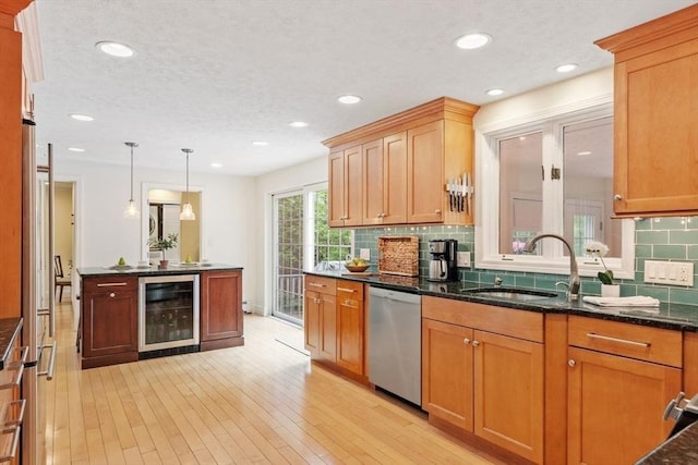 163 Candlestick Rd, North Andover, MA 01845 - kitchen featuring beverage cooler, stainless steel dishwasher, a sink, decorative backsplash, and recessed lighting