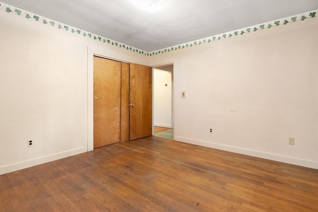 14 Forty Steps Ln, Nahant, MA 01908 - unfurnished bedroom featuring wood-type flooring and a closet