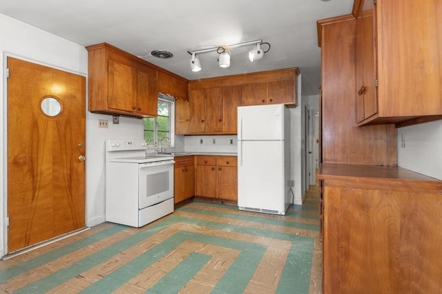 14 Forty Steps Ln, Nahant, MA 01908 - kitchen with white appliances, brown cabinets, light flooring, and light countertops