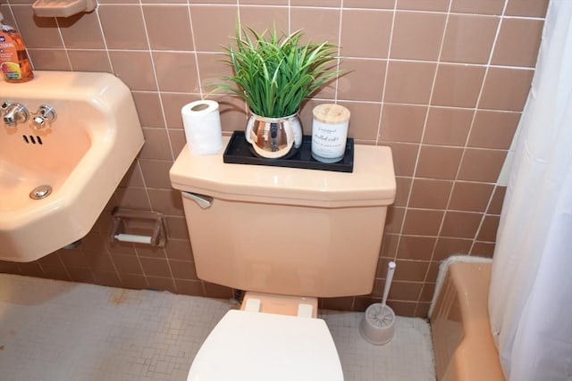 130 Windham Rd, Boston, MA 02136 - full bathroom with tile walls, toilet, a sink, and tile patterned floors