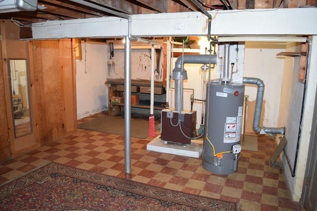 130 Windham Rd, Boston, MA 02136 - unfinished below grade area with tile patterned floors and gas water heater