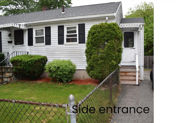 130 Windham Rd, Boston, MA 02136 - view of front of home with roof with shingles, entry steps, and a chimney