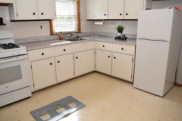 130 Windham Rd, Boston, MA 02136 - kitchen with white appliances, a sink, light countertops, and backsplash