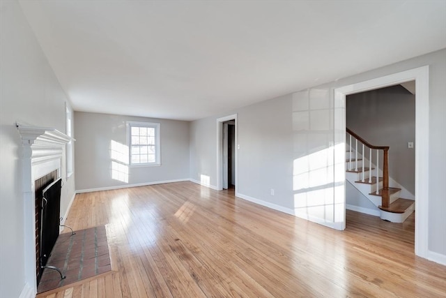 unfurnished living room featuring light hardwood / wood-style flooring