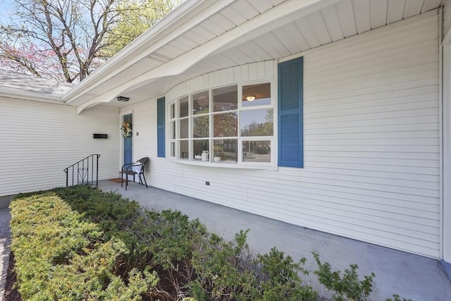 view of exterior entry with covered porch