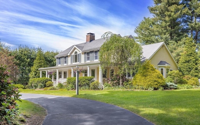 30 Pleasant St S, Natick, MA 01760 - view of front facade featuring a front yard, covered porch, and a chimney