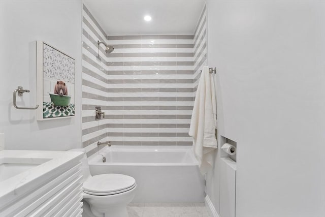 full bathroom with toilet, tiled shower / bath combo, and vanity
