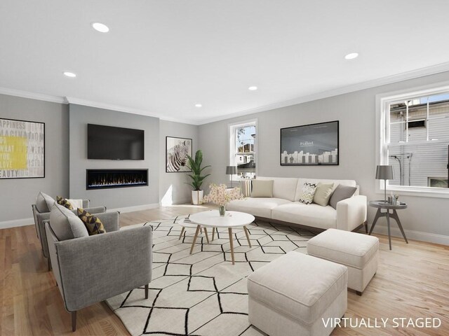 living area featuring ornamental molding, light wood-type flooring, baseboards, and recessed lighting