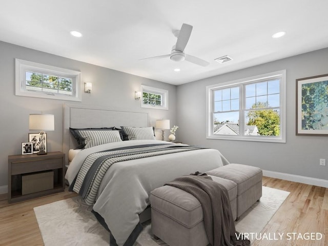 bedroom with light wood-style flooring, visible vents, baseboards, and recessed lighting