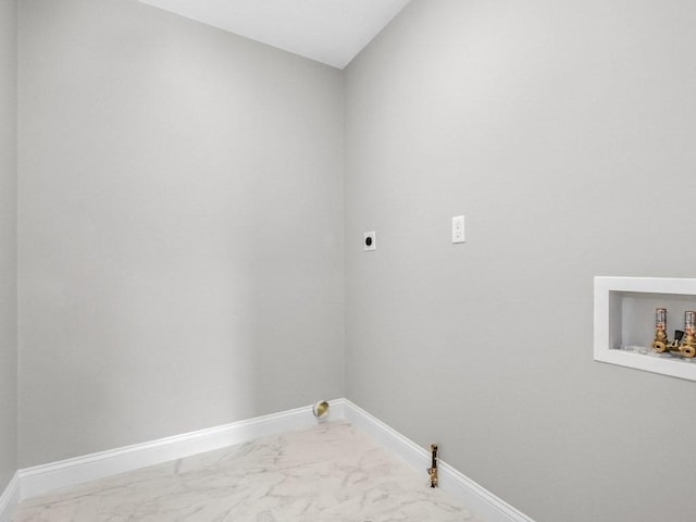 laundry room with gas dryer hookup, marble finish floor, baseboards, and laundry area