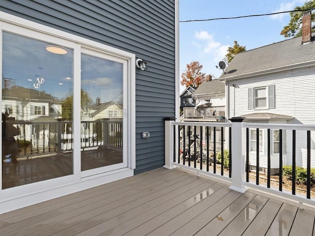 wooden deck with a residential view