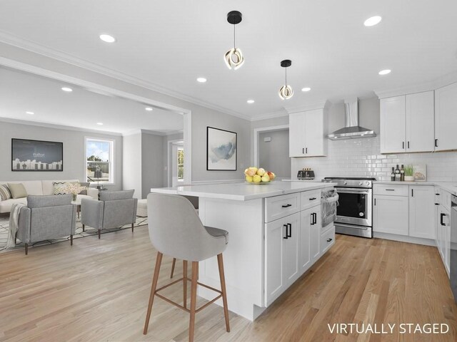 kitchen featuring stainless steel electric range oven, tasteful backsplash, light countertops, open floor plan, and wall chimney exhaust hood