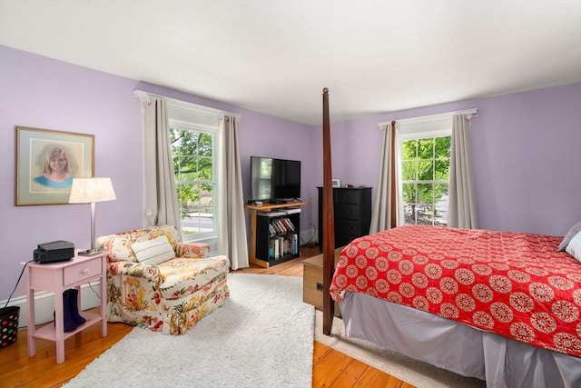 32 School St, Belmont, MA 02478 - bedroom with multiple windows and light wood-style flooring