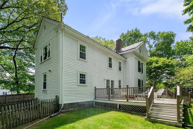32 School St, Belmont, MA 02478 - back of property with a wooden deck and a chimney