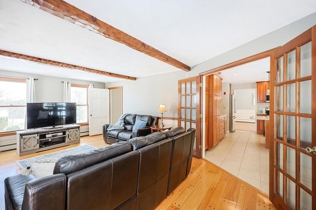 living area with baseboard heating, french doors, light wood-style floors, a baseboard heating unit, and beam ceiling