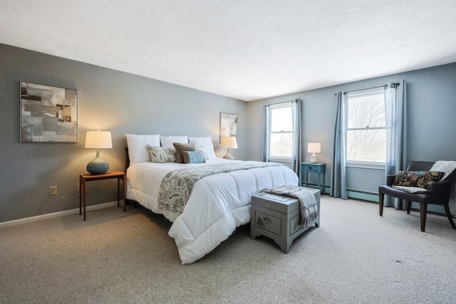 bedroom featuring baseboards and light colored carpet