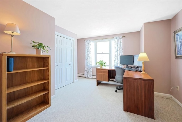 office area with light carpet, a baseboard radiator, and baseboards