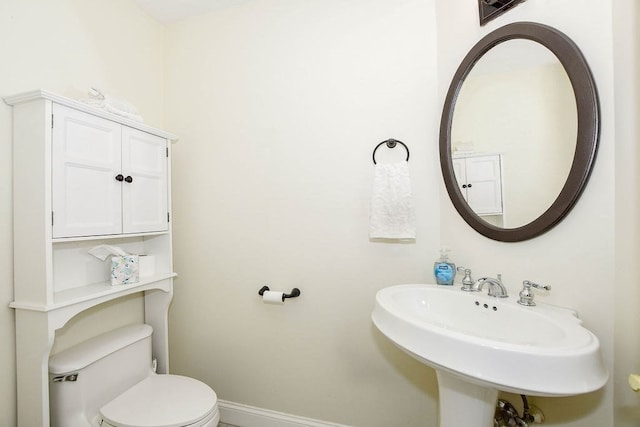 bathroom with sink and toilet