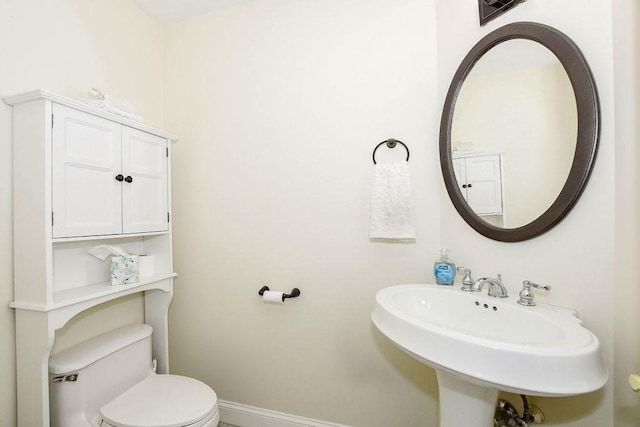 4 Olde Logging Rd, Marion, MA 02738 - half bath with toilet, baseboards, and a sink
