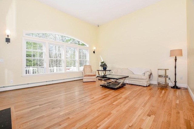 4 Olde Logging Rd, Marion, MA 02738 - sitting room featuring a baseboard heating unit, wood finished floors, and baseboards