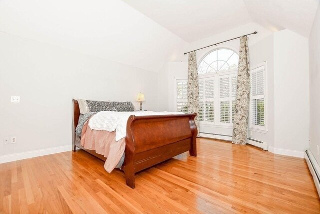 4 Olde Logging Rd, Marion, MA 02738 - bedroom with vaulted ceiling, light wood finished floors, a baseboard heating unit, and baseboards