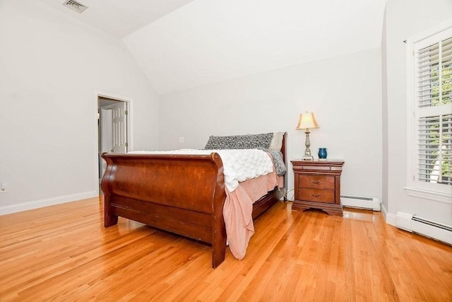4 Olde Logging Rd, Marion, MA 02738 - bedroom featuring a baseboard heating unit, light wood-type flooring, baseboards, and lofted ceiling