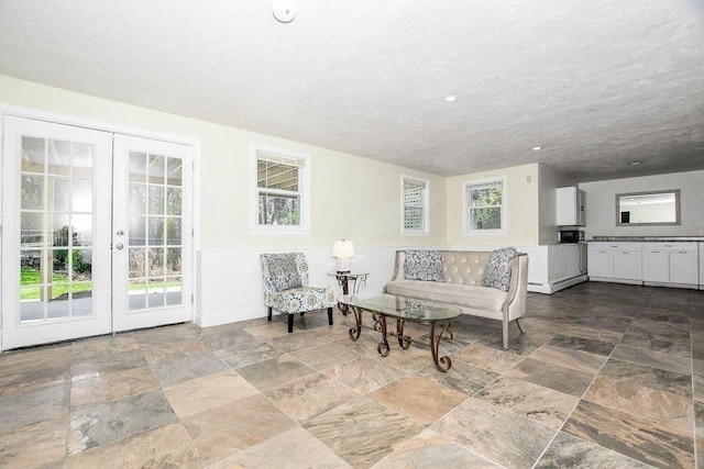 4 Olde Logging Rd, Marion, MA 02738 - living area featuring french doors, stone finish floors, and recessed lighting