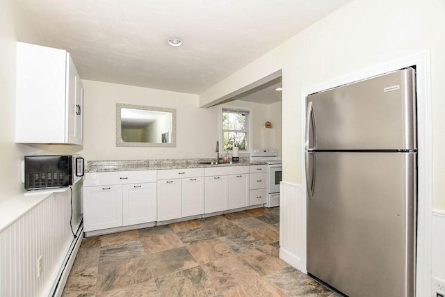 4 Olde Logging Rd, Marion, MA 02738 - kitchen with freestanding refrigerator, white electric range oven, a sink, stone finish floors, and white cabinets