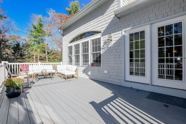 wooden deck featuring outdoor lounge area