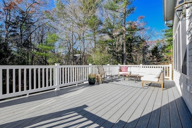 wooden deck featuring an outdoor living space