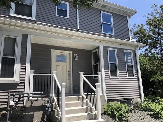 28-32 Calvary St, Waltham, MA 02453 - doorway to property featuring a porch