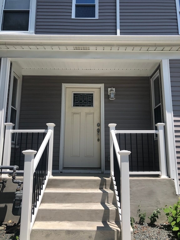 doorway to property featuring covered porch