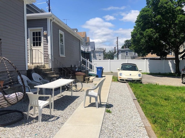 28-32 Calvary St, Waltham, MA 02453 - view of patio / terrace featuring entry steps and fence