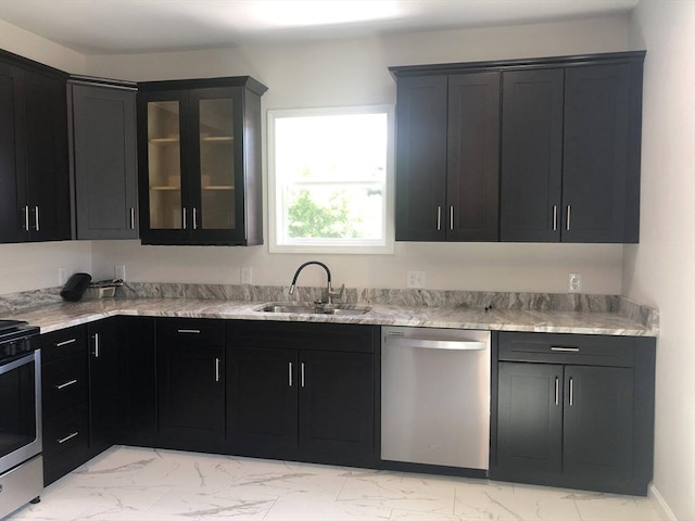 28-32 Calvary St, Waltham, MA 02453 - kitchen featuring dark cabinets, a sink, marble finish floor, appliances with stainless steel finishes, and glass insert cabinets