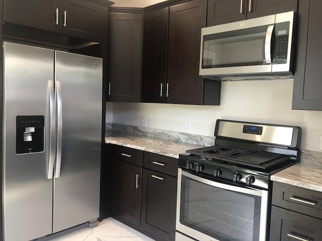28-32 Calvary St, Waltham, MA 02453 - kitchen with appliances with stainless steel finishes, marble finish floor, dark brown cabinets, and light stone counters