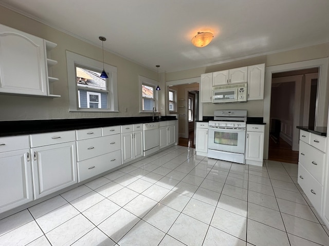 kitchen featuring hanging light fixtures, crown molding, light tile patterned flooring, white cabinets, and white appliances