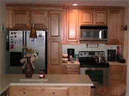 kitchen featuring light countertops and stainless steel appliances