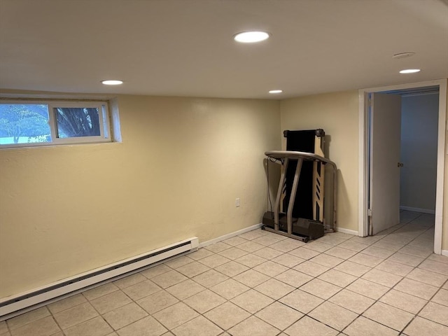 basement with light tile patterned floors, recessed lighting, and a baseboard heating unit