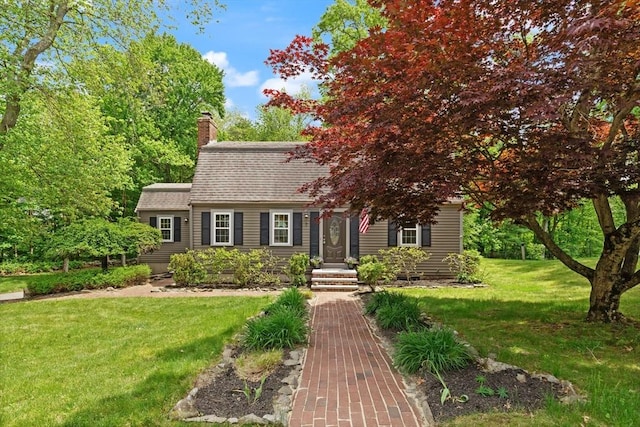 7 Chestnut St, West Newbury, MA 01985 - dutch colonial with a chimney, a front yard, and a shingled roof