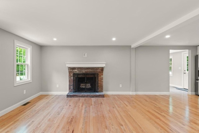7 Chestnut St, West Newbury, MA 01985 - unfurnished living room featuring light wood-style floors, a fireplace, baseboards, and recessed lighting