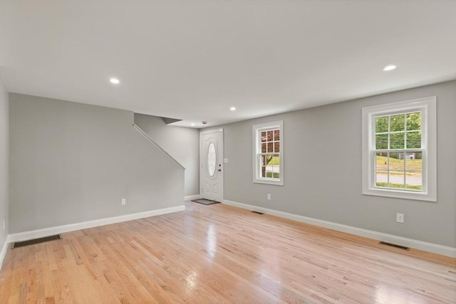 7 Chestnut St, West Newbury, MA 01985 - unfurnished living room featuring light wood finished floors, baseboards, and recessed lighting