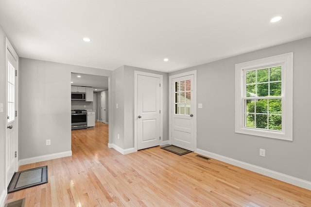 7 Chestnut St, West Newbury, MA 01985 - entryway with light wood-style floors, baseboards, and recessed lighting