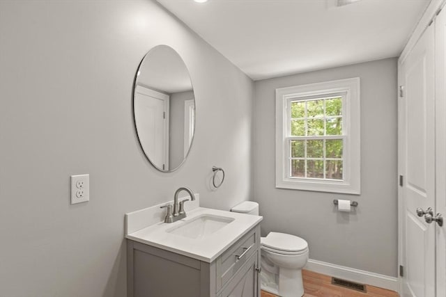 7 Chestnut St, West Newbury, MA 01985 - bathroom featuring vanity, baseboards, wood finished floors, and toilet