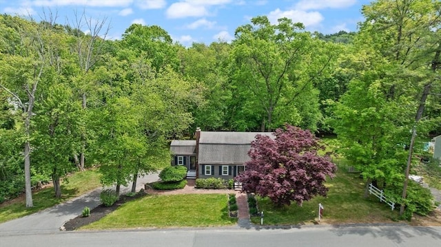 7 Chestnut St, West Newbury, MA 01985 - dutch colonial with a view of trees, driveway, a front yard, and a chimney