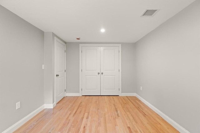 7 Chestnut St, West Newbury, MA 01985 - unfurnished bedroom featuring light wood-style floors, baseboards, a closet, and recessed lighting