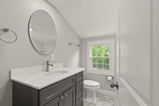 7 Chestnut St, West Newbury, MA 01985 - bathroom with vanity, lofted ceiling, toilet, and baseboards