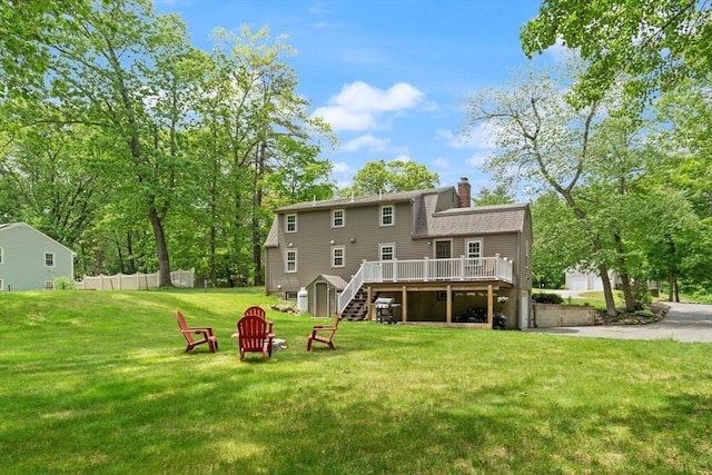 7 Chestnut St, West Newbury, MA 01985 - rear view of property with stairway, a wooden deck, a chimney, and a fire pit