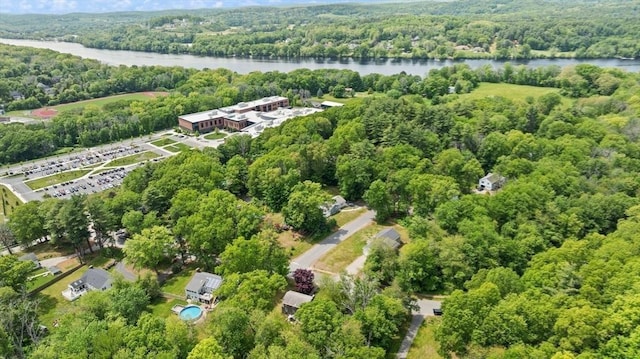 7 Chestnut St, West Newbury, MA 01985 - drone / aerial view of a forest and a nearby body of water