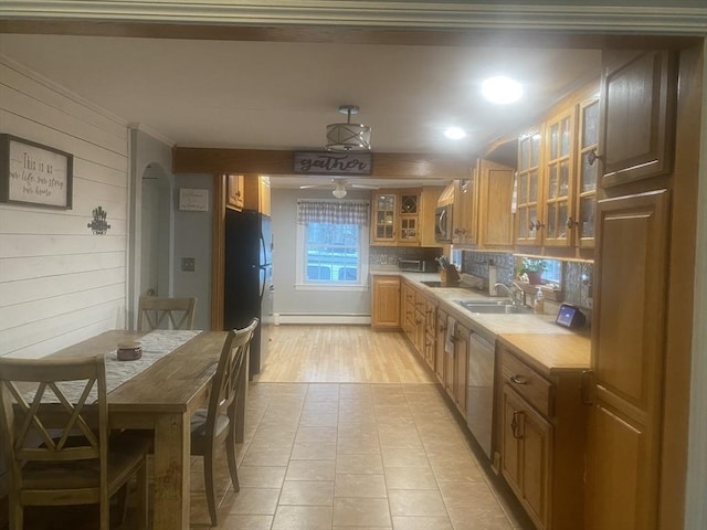 169 Green St, Gardner, MA 01440 - kitchen with a sink, a baseboard heating unit, stainless steel appliances, light countertops, and decorative backsplash