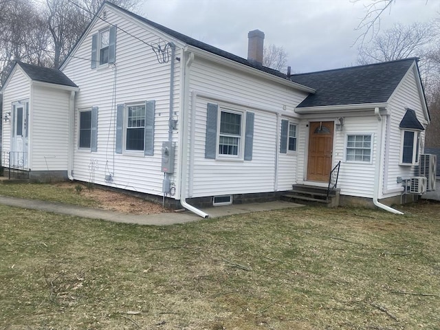 169 Green St, Gardner, MA 01440 - rear view of property with entry steps, a chimney, a lawn, and roof with shingles